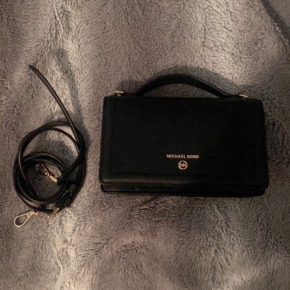 Michael Kors purse, black, comes with shoulder strap.